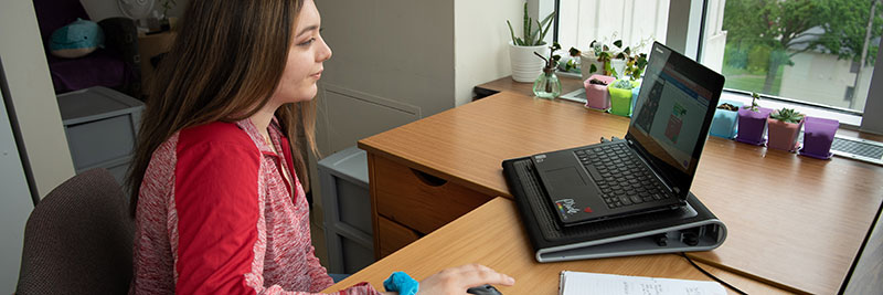 A student having an online meeting.